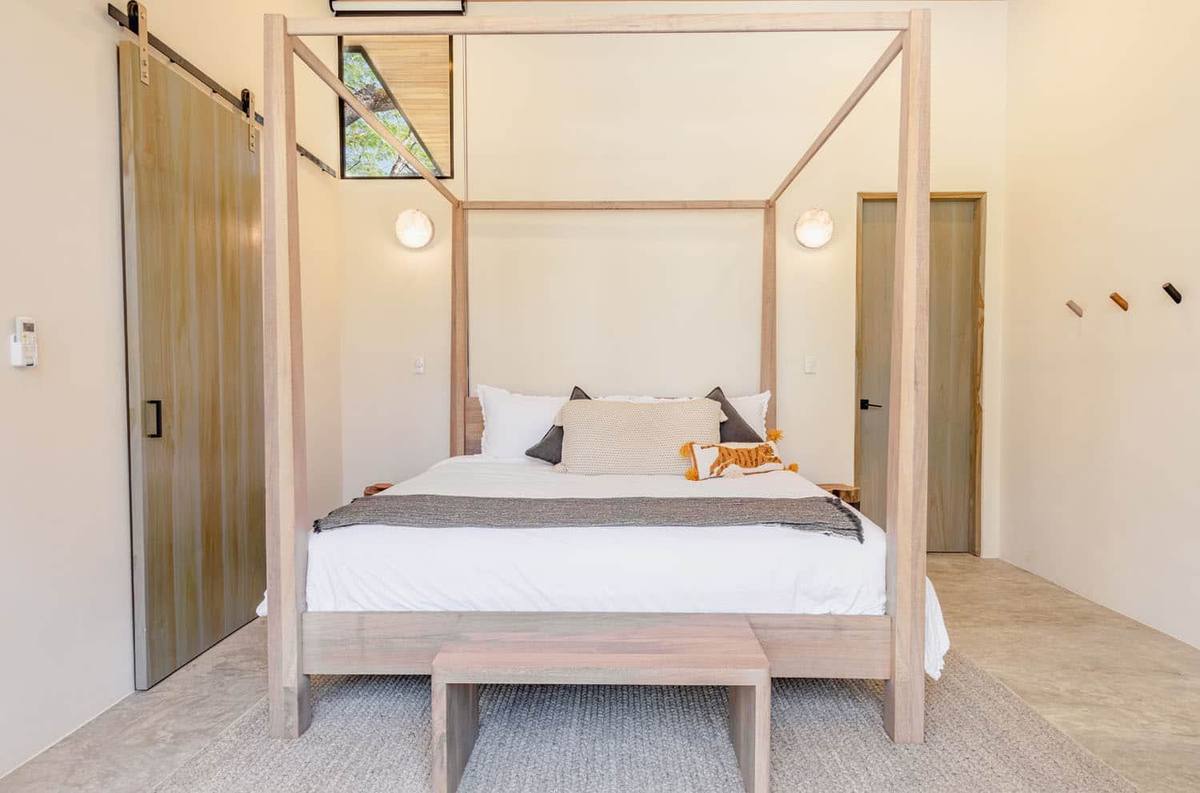 Villa Two - bedroom with four-poster bed
